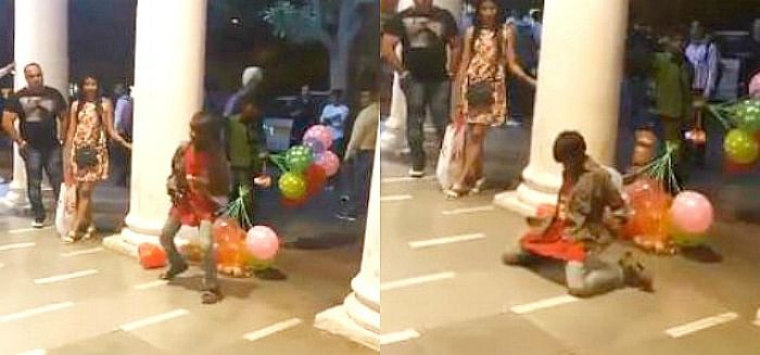 Boy selling balloons in Connaught Place dancing fantastically
