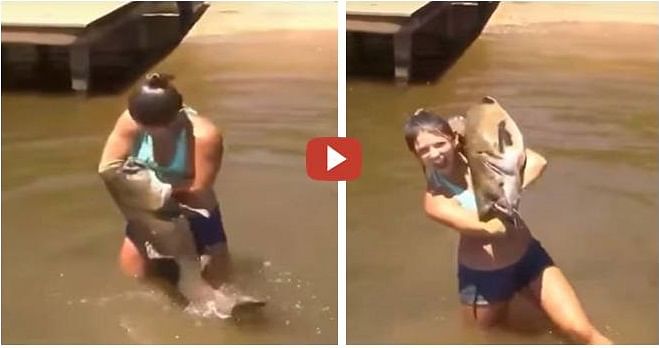 Girl catches cat fish with bare hands