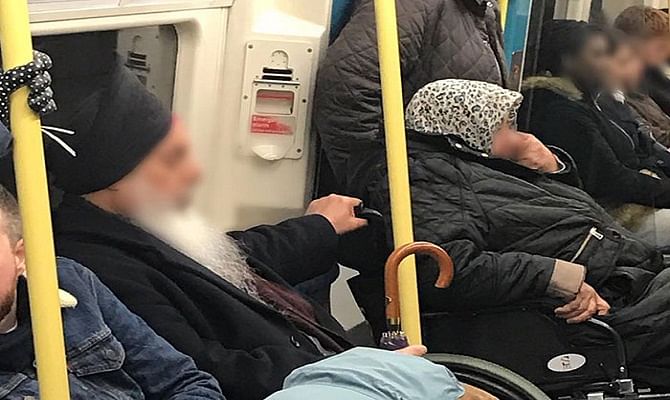 Sikh man helping Muslim woman in America