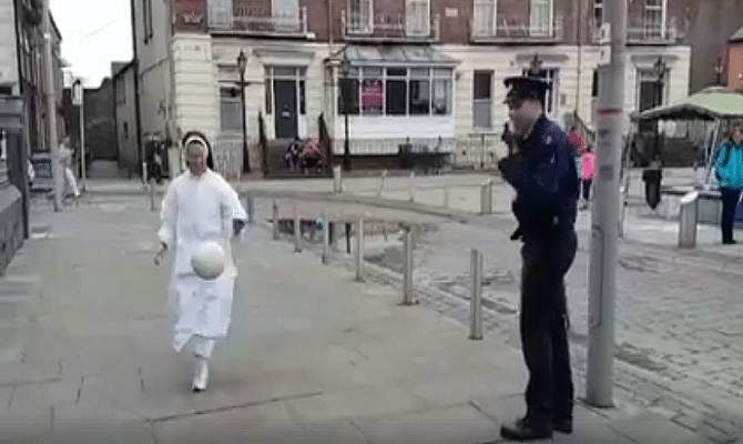 Viral and Trending Video of an Irish Nun playing football with police officer