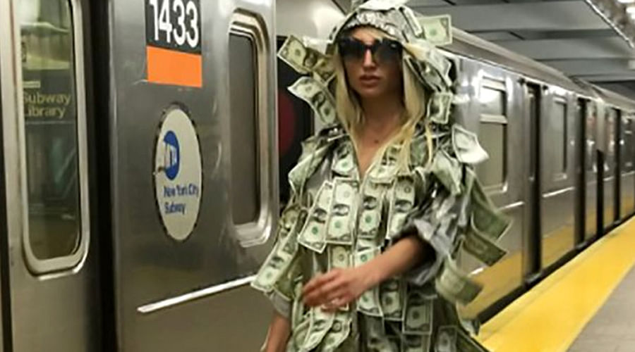 Model Vicky Xipolitakis takes to streets wearing dress made of money