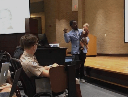 to help single mom attend his lecture, a professor is carrying her baby 