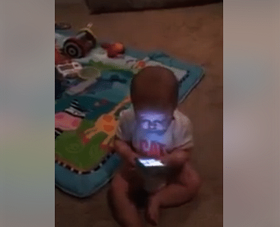 little baby is playing with cell phone viral video
