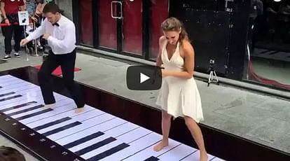 Couple playing piano on the street by their foots, Watch amazing video 