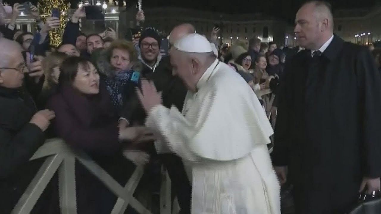 pope francis pull himself from woman grasp