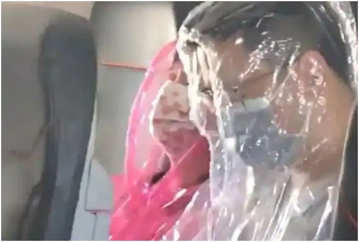 passengers wrap themselves in full-body plastic sheets during travel in flight