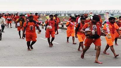 Kanwar Yatra : न गर्मी और धूप की चिंता, न ही आंधी, बारिश का डर, काशी-प्रयाग हाईवे पर चढ़ा भोले की भक्ति का नशा Highway painted in devotional color of saffron, cheers of Bol Bam echoing from Prayagraj to Kashi