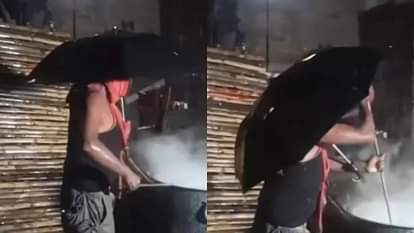 Viral Video: हलवाई के डेडिकेशन की हो रही है तारीफ, झमाझम बारिश में भी छतरी लेकर बना रहा था खाना Viral Video The dedication of the cook is being praised he was cooking food with umbrella even in heavy rain