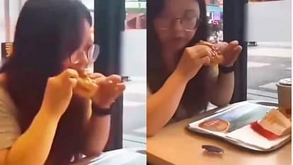 Viral Video: जिंदा कॉकरोच बर्गर के नीचे दबाकर खा गई लड़की, वीडियो देख लोगों की फटी रह गई आंखें Girl ate a live cockroach by pressing it under a burger people were shocked after watching the video