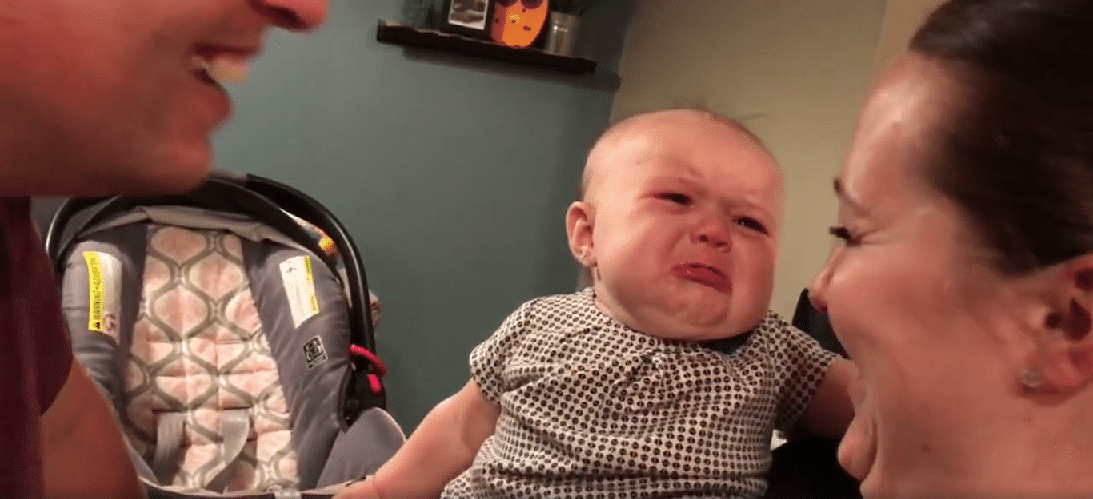this baby girl is jealous of her parents kissing each other and has the cutest reaction