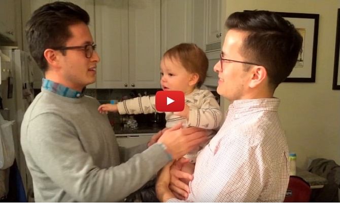 Baby confused between dad and his twin brother