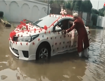This Pakistani ‘dulha’ pushes car through flood waters to reach wedding venue
