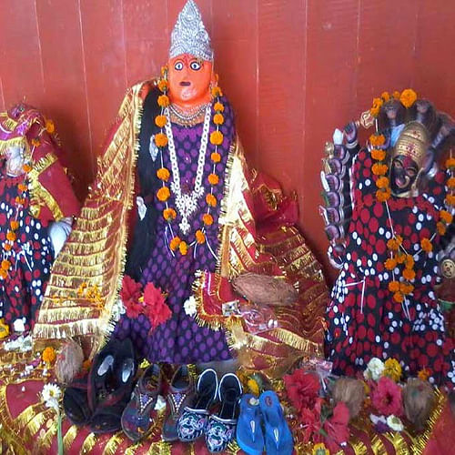 people offer sandles and boots in jiji bai temple of madhya pradesh