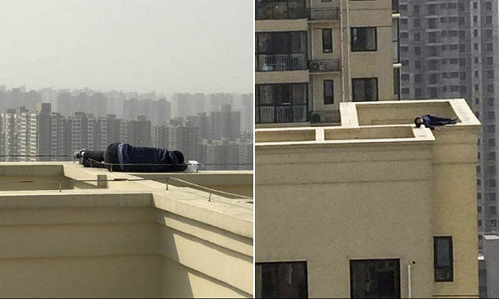 drunk man found on taking a nap on narrow ledge of building in china