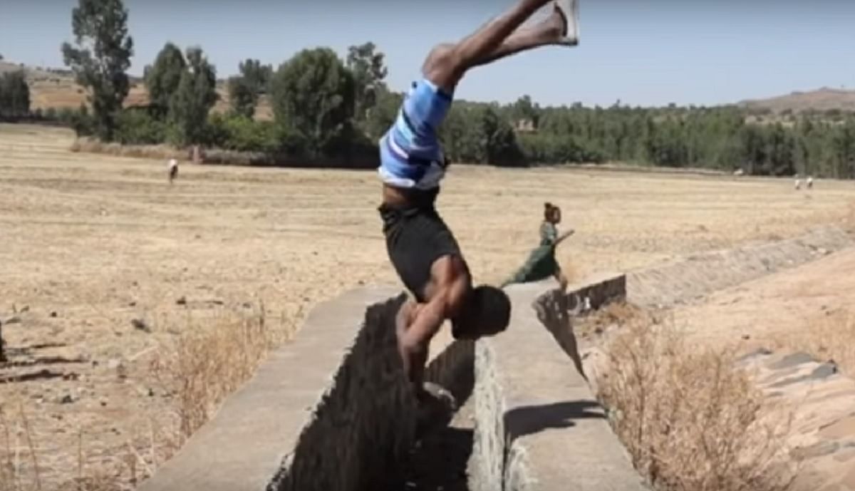 Ethiopian guy who can walks on his hands like his feet 