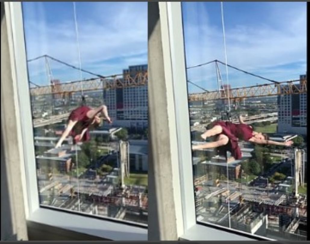 Woman hanging from 17th floor building shows incredible contemporary dance moves