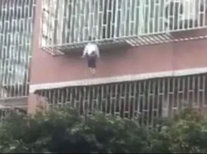 girl slips from balcony neck trapped in railing and body hung in air china shocking video viral