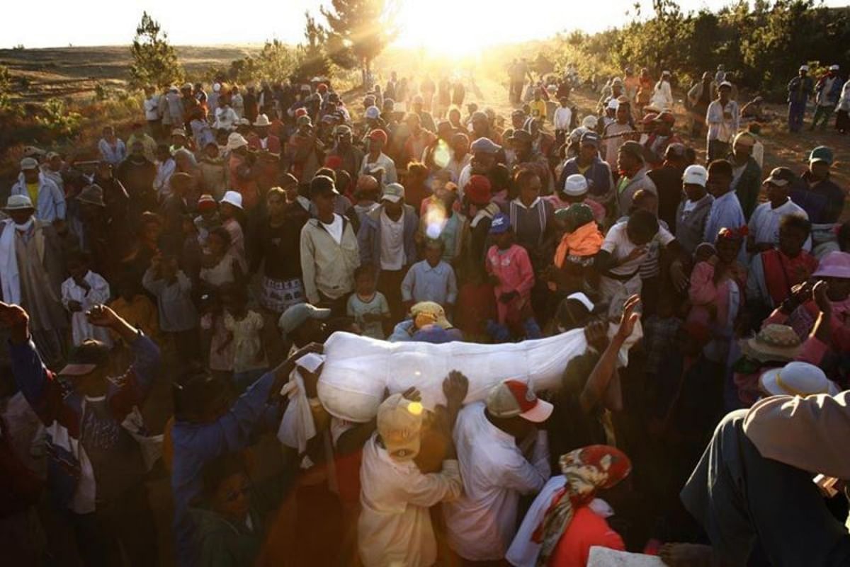 Famadihana is a bizarre funerary ritual in Madagascar people dance with their love one deadbodies