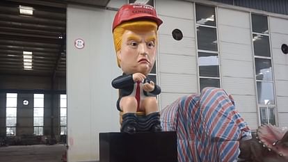why robot of trump sat on a toilet in uk