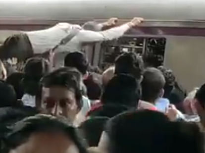 common people struggle to board a local train
