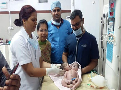 mp woman gives birth to boy with 2 heads 3 hands and one heart