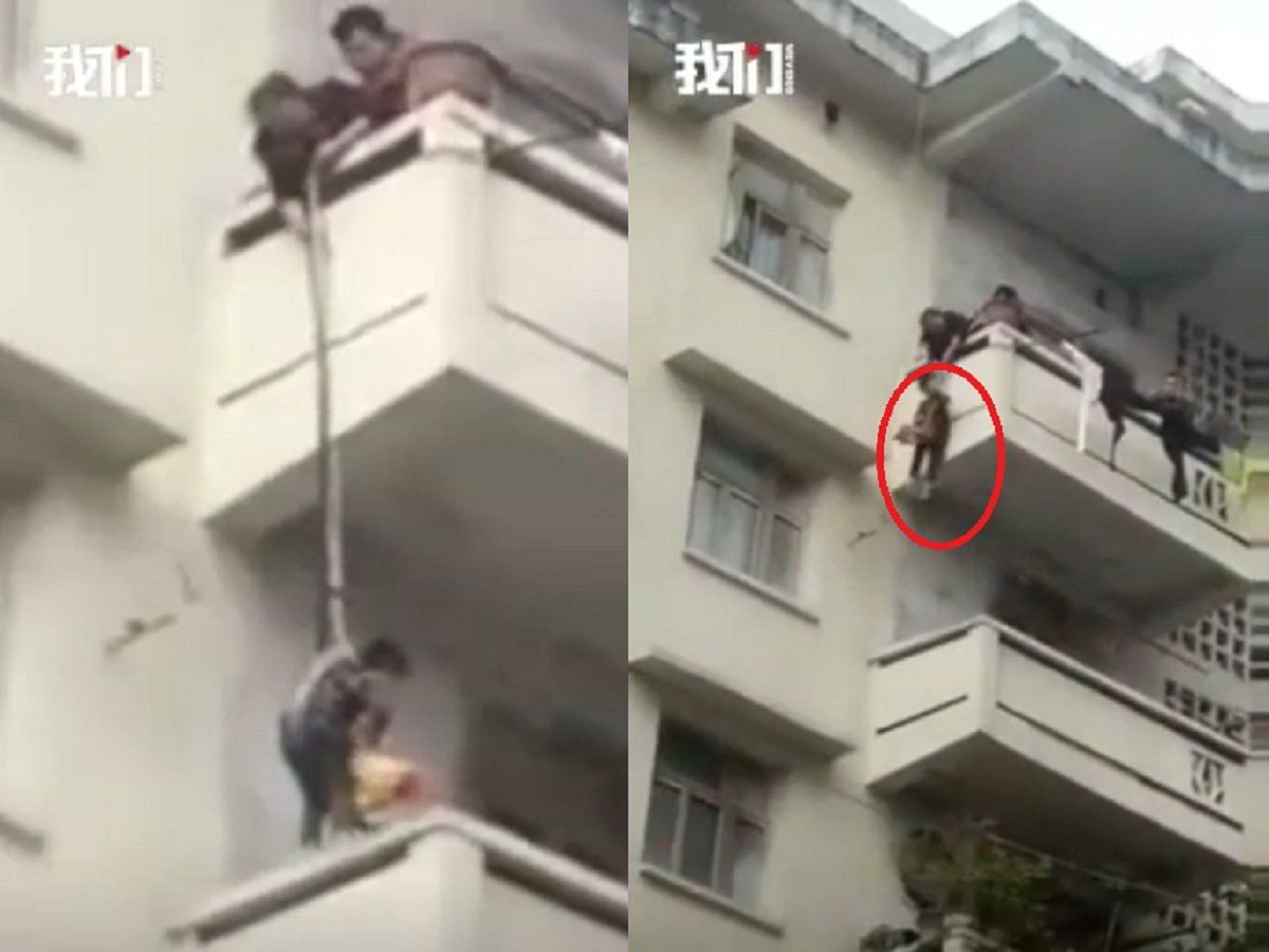 chinese woman dangle her grandson to save cat
