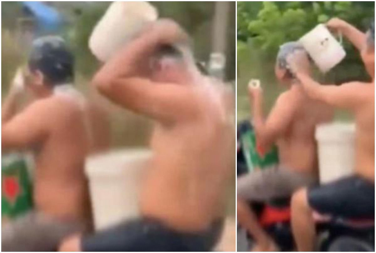 viral video of two man take showering while riding