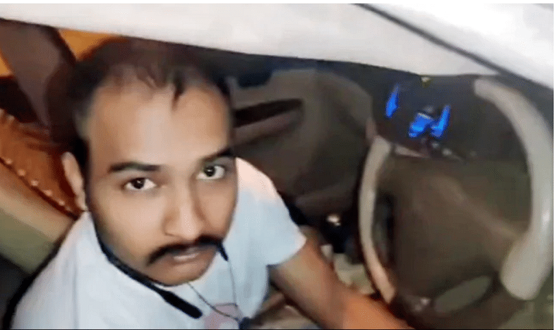 viral video of frustrated husband hide in covered car