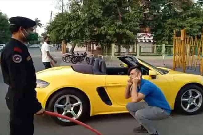 Viral video of indore man who was driving his luxury porsche two seater car police give punisment to do squats