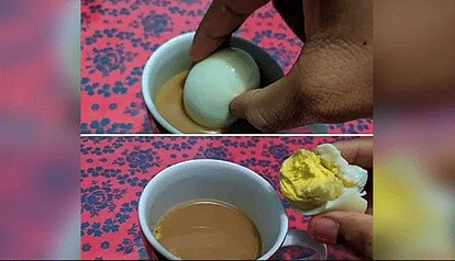 अंडे को चाय में डुबाते हुए फोटो
