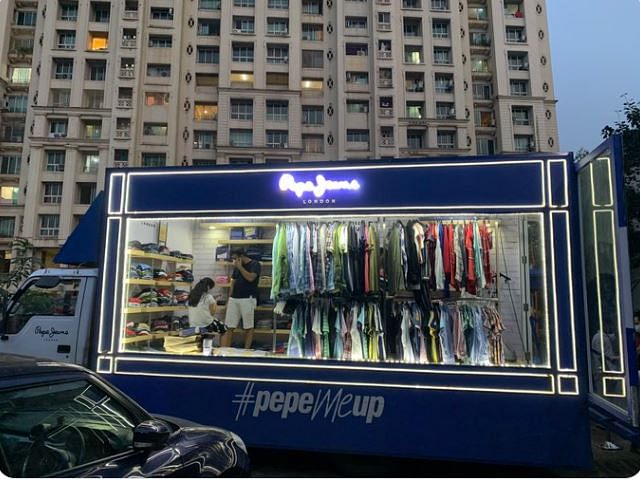viral photo of mobile clothing store sell clothes in society people did hilarious comment on it