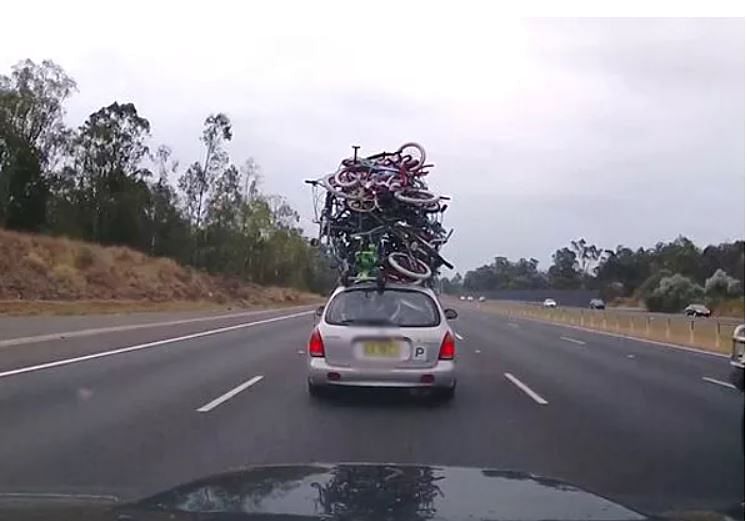 viral photo of man who busted bundle of bicycles on top of car