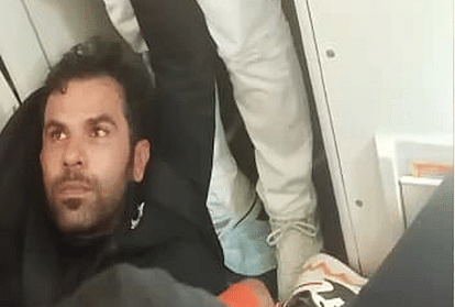 varanasi passenger tries to open emergency gate of flying airplane