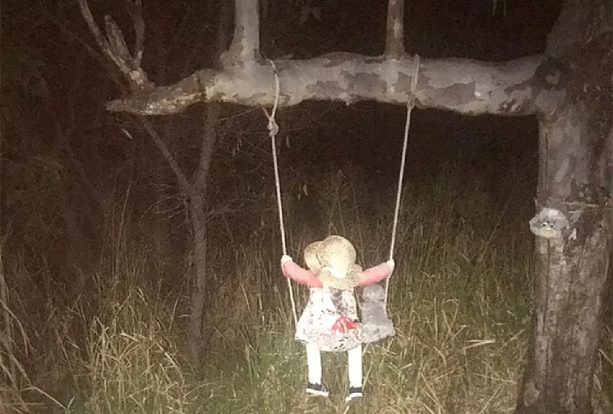 Haunted little doll sitting on swing in North Queensland Australia