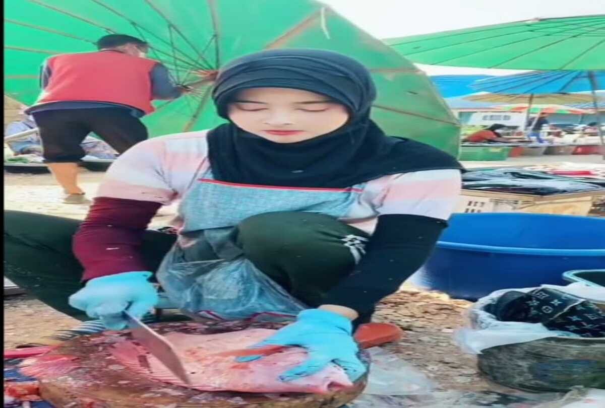 beautiful girl was selling fish in market video goes viral on social media