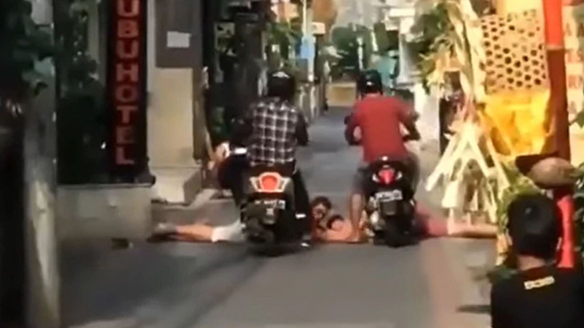 two boy were lying on the road scooter driver ran away after being crushed