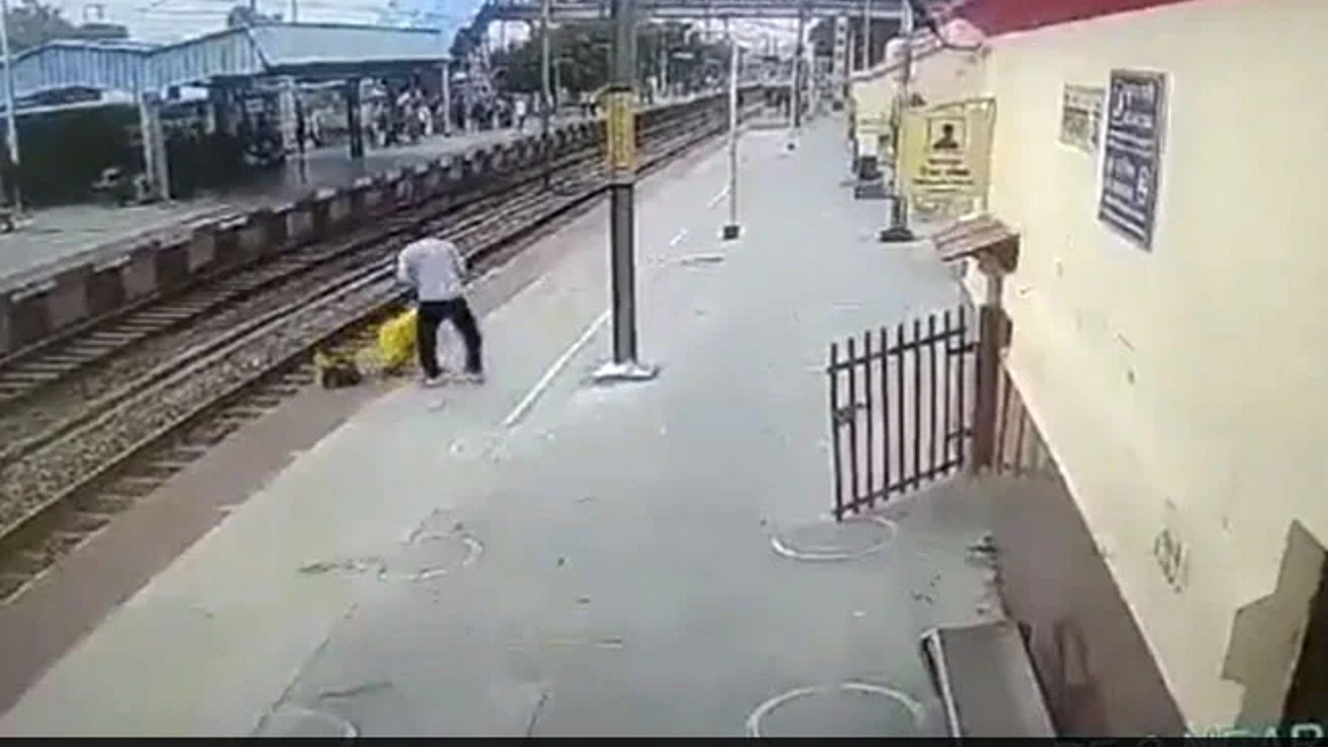 woman crossing railway line suddenly superfast train came on track Shikohabad video viral