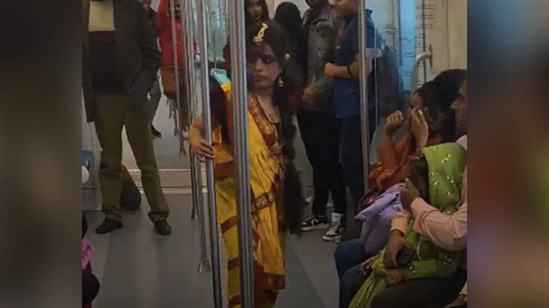 girl dressed as bhool bhulaiyaa character manjulika on greater noida aqua line metro