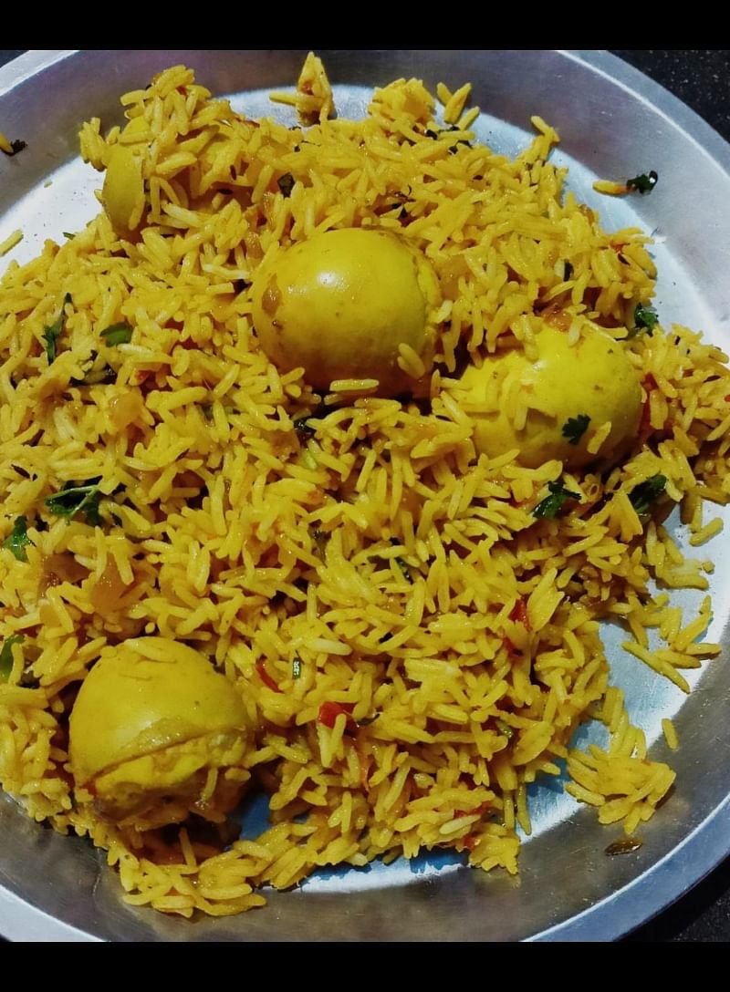 Optical illusion spot the fourth egg in the plate.of biryani