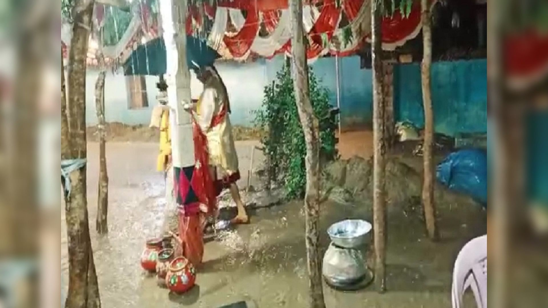 Wedding Video: bride and groom taking pheras carrying an umbrella in heavy rain video goes viral