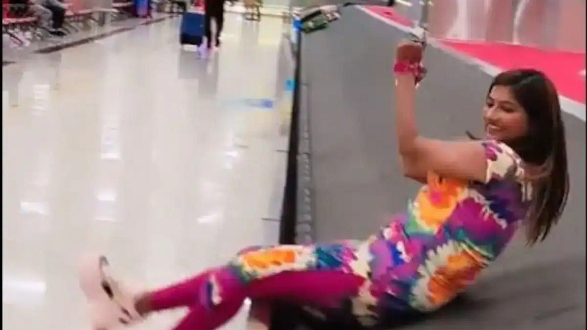 Viral Video: woman lying on airport baggage carousel doing strange activities to make a reels viral video