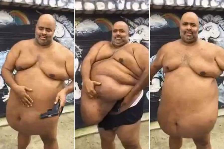 man hides pistol under his tummy