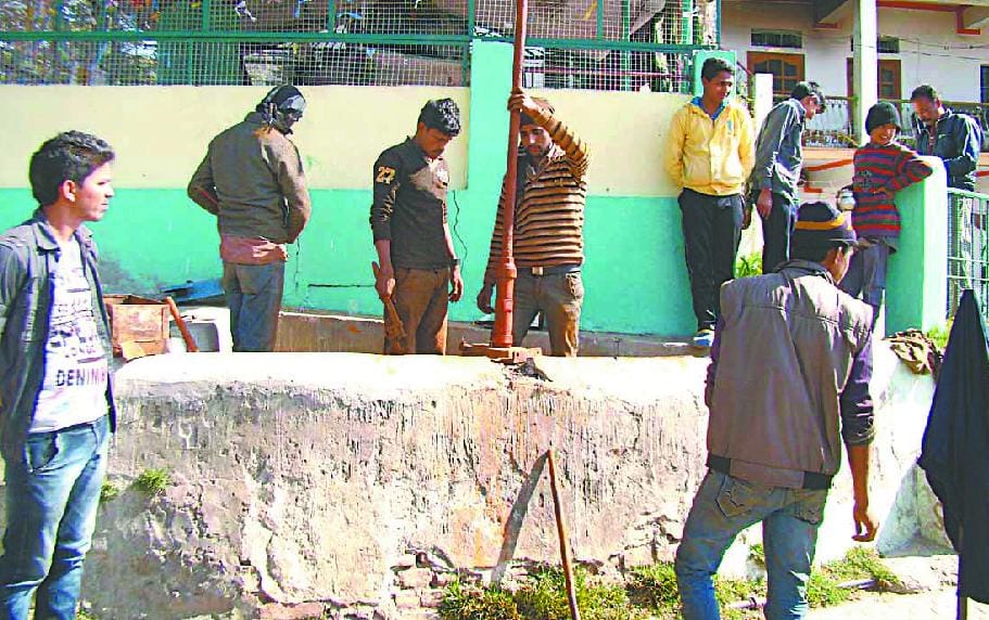 Test takers who are children carrying water