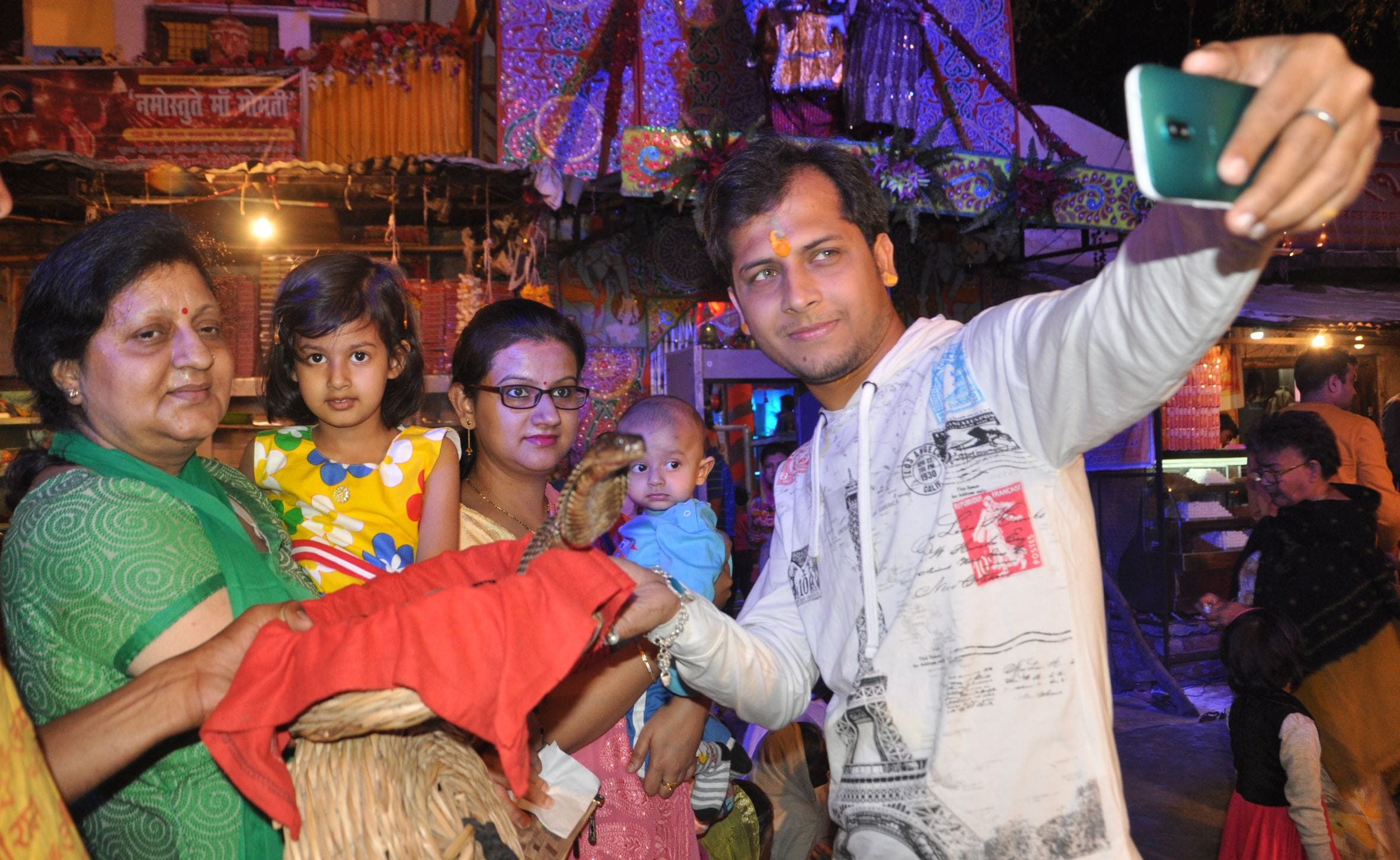 people take selfie with snake on mahashivratri