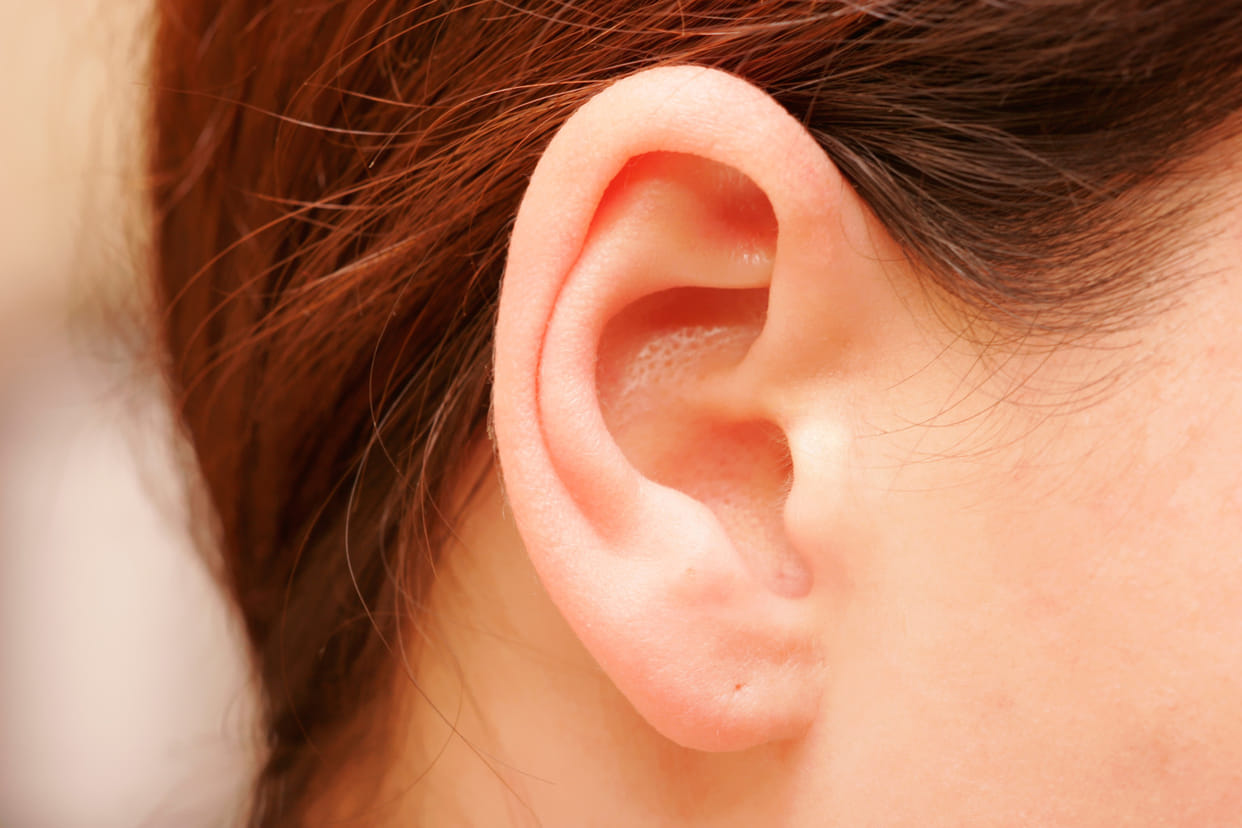 man bites ear of a devotte