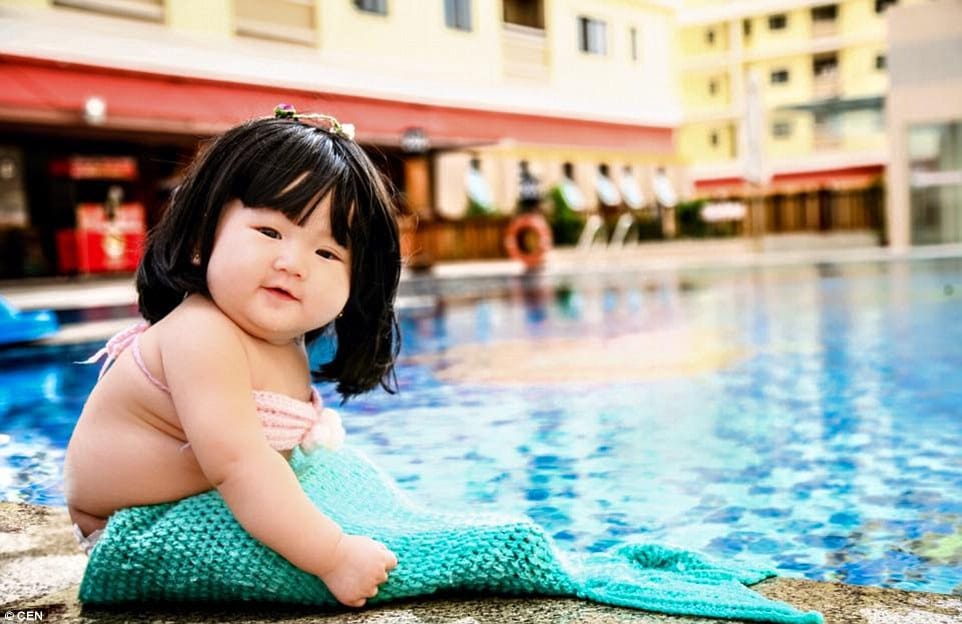parents dressed their kid as mermaid
