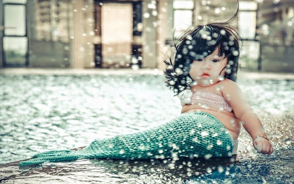 parents dressed their kid as mermaid