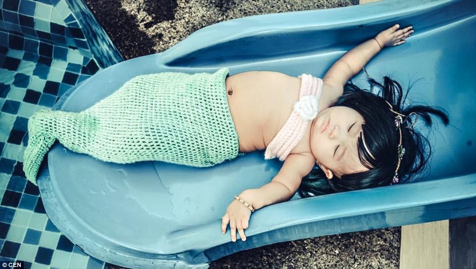 parents dressed their kid as mermaid