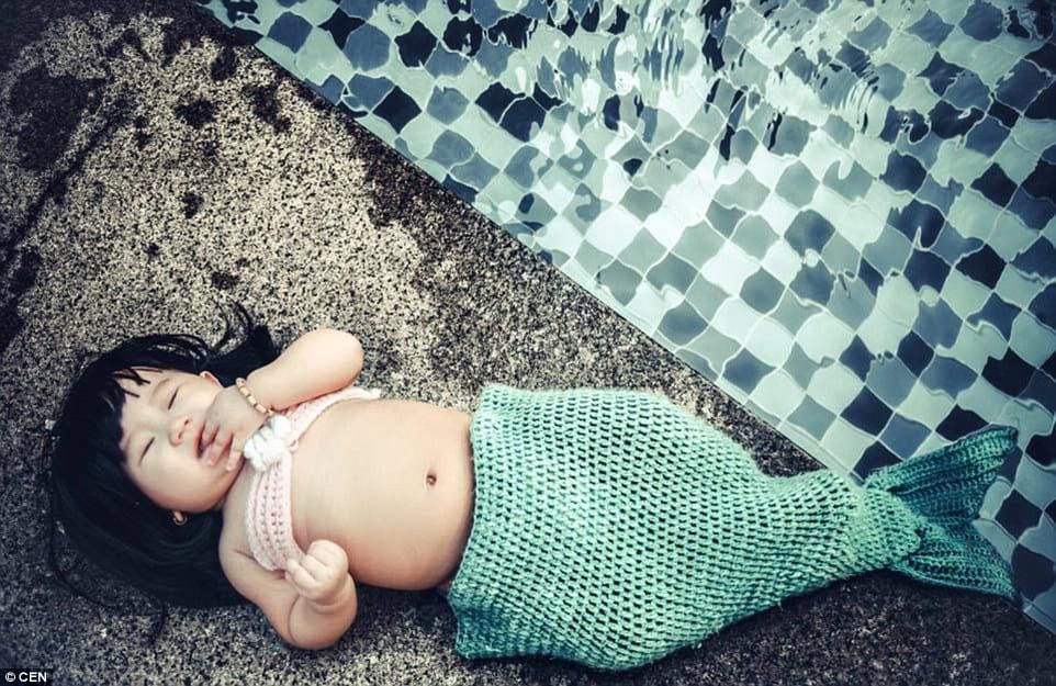 parents dressed their kid as mermaid