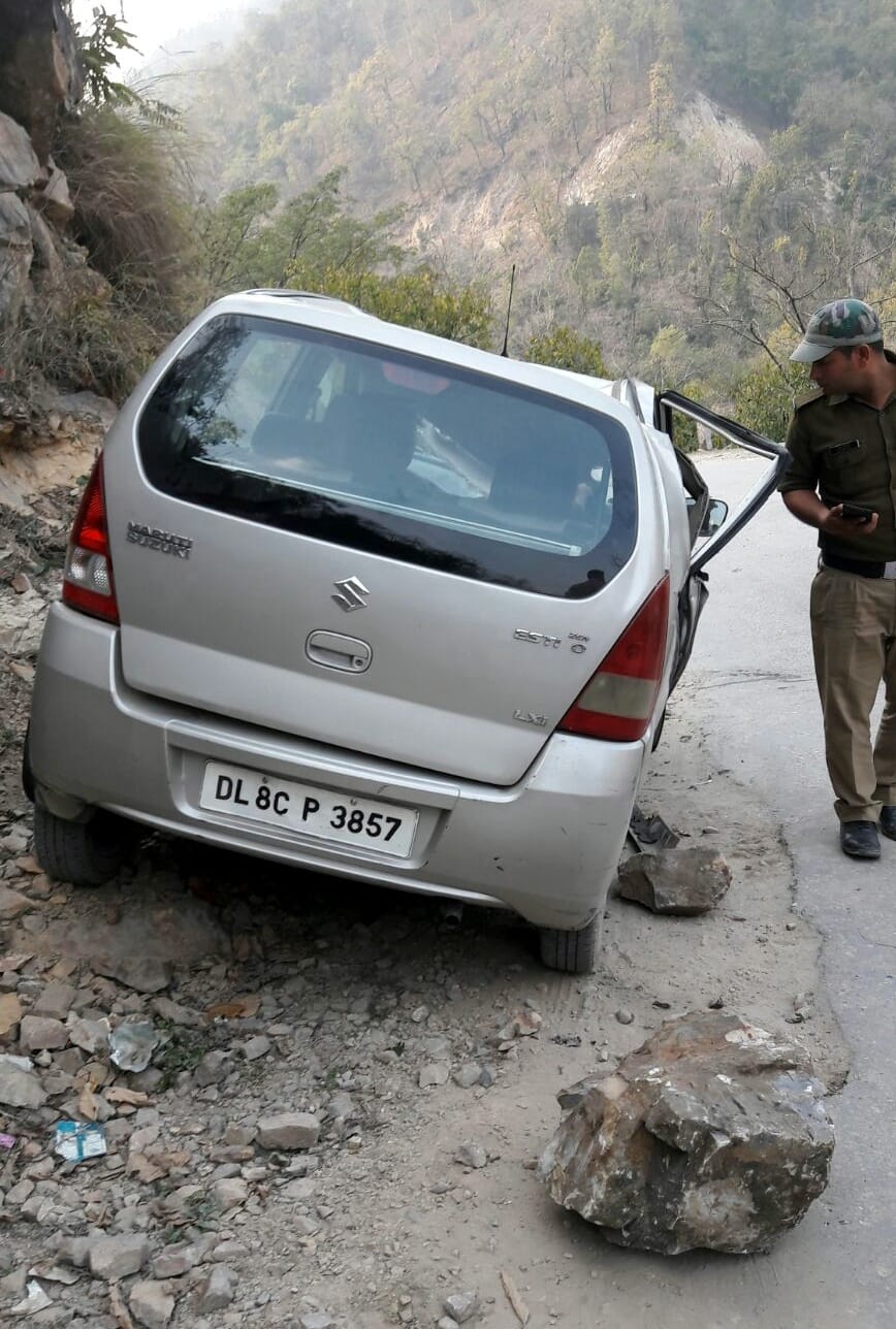 three injured by falling rocks at cars